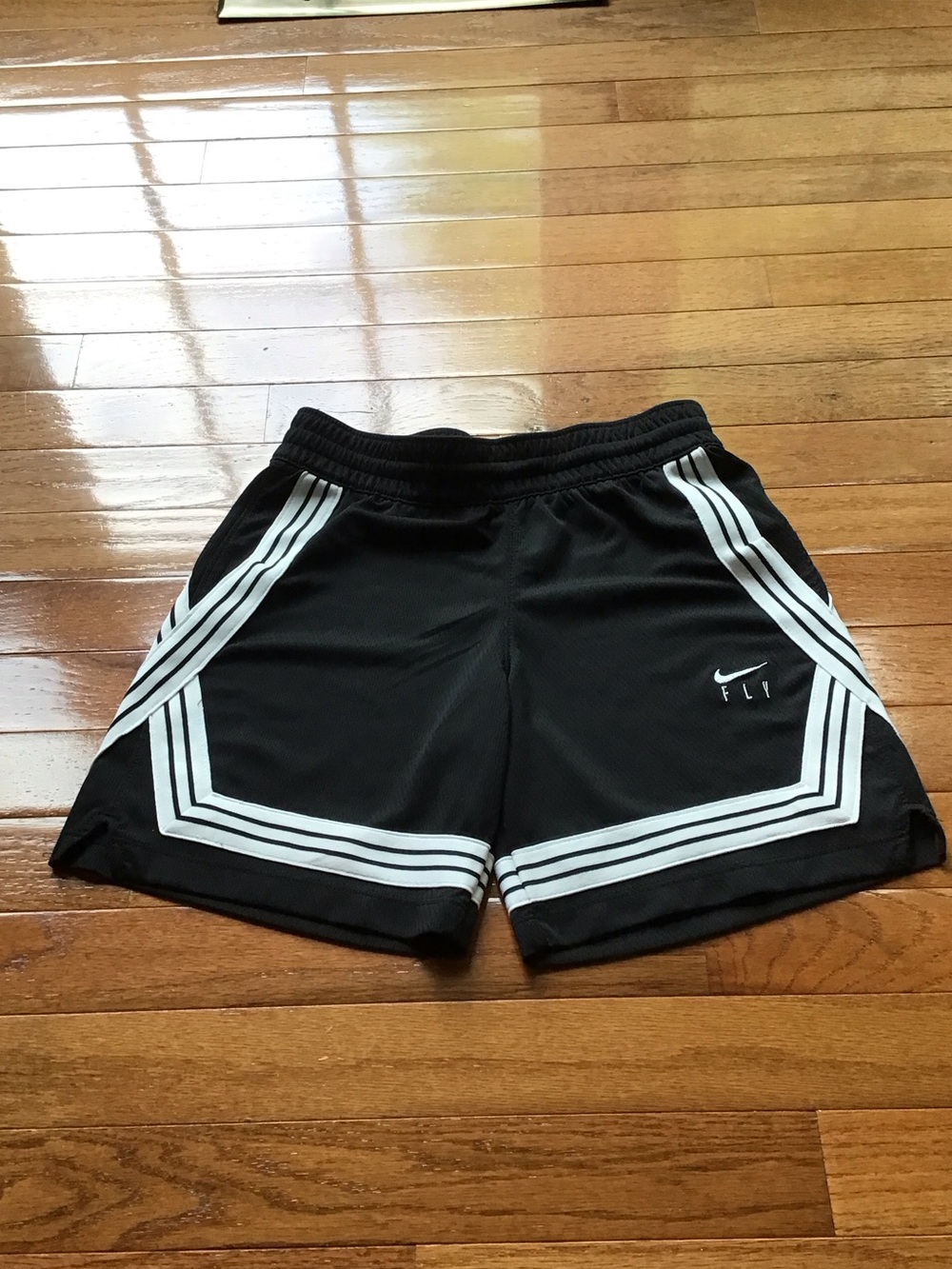 Nike Black Mesh Shorts with White Stripe Accents
